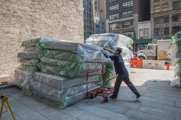 new mattresses piled up outside the the Holiday Inn New York City - Times Square